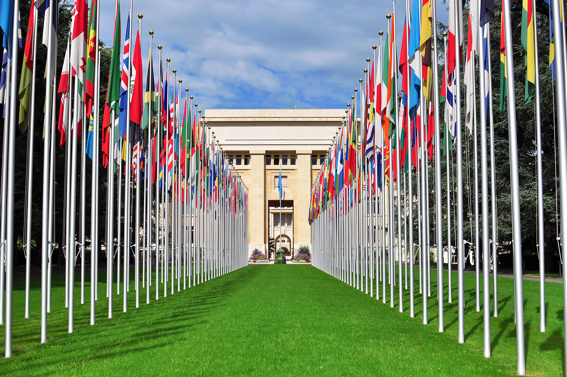 National flags in front of the building of the United Nations in Geneva