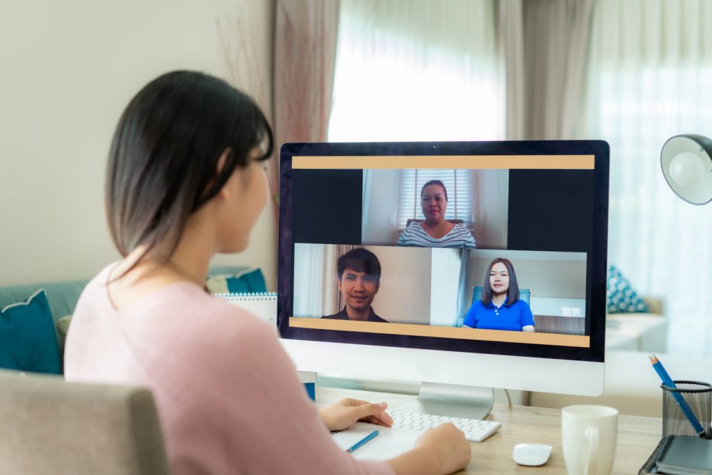 A women sitting in front of a computer during online training