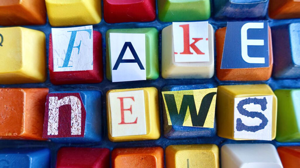 Colourful keyboard with newspaper letters sticked on top.